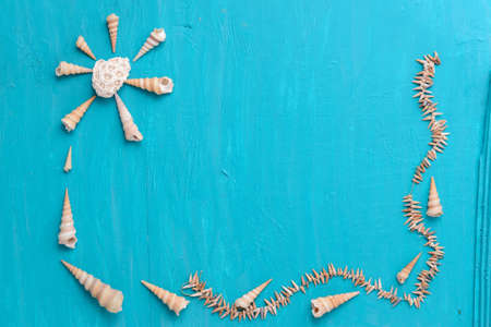 Corals and  pearls  on wooden blue backgroundの写真素材