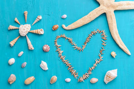 Corals and  pearls  on wooden blue background