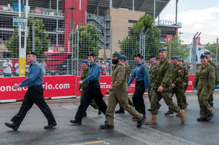 TORONTO, ON - JULY 16: Soldiers of the Canadian armed forces march along the highway during 2017 Honda Indycar Series Race in Toronto at Exhibition Place in Toronto, ON, Canada on July 16 2017のeditorial素材
