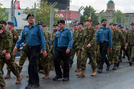 TORONTO, ON - JULY 16: Soldiers of the Canadian armed forces march along the highway during 2017 Honda Indycar Series Race in Toronto at Exhibition Place in Toronto, ON, Canada on July 16 2017のeditorial素材