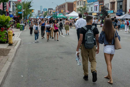 TORONTO, ON â August 11: People are walking on the Danforth Avenue in the Greektown district of Toronto during the Torontoâs 24th annual Taste of the Danforth street festival on August 11-13, 2017.のeditorial素材