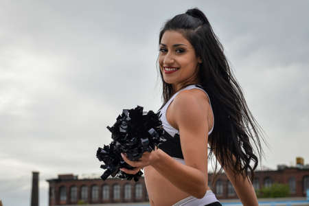 September 02, 2017. Toronto, Canada - Cheerleader on the field before Super 8s Round 4 game between Toronto Wolfpack (Canada) vs Whitehaven RLFC (United Kingdom) at Allan A. Lamport Stadium in Toronto, Canadaのeditorial素材