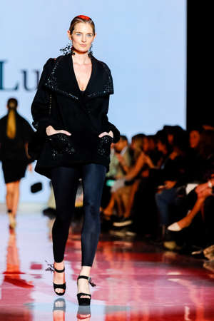 October 3, 2017. Toronto, Canada â  fashion models represents different designers clothes from Ceneca - Red collection for men and women during runway presentation at Toronto Womenâs Fashion Week on October 3, 2017 in Toronto, Canadaのeditorial素材