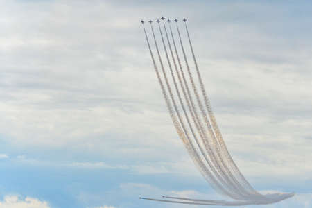 Hawk T1 jet operated by the British Royal Air Force's (RAF) Red Arrows aerobatic demonstration team, performs a maneuver at the 70th annual Canadian International Air Show (CIAS) over Lake Ontario in Toronto, ON, Canada on September 1, 2019のeditorial素材