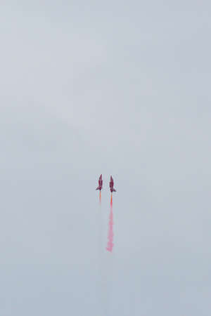 Hawk T1 jet operated by the British Royal Air Force's (RAF) Red Arrows aerobatic demonstration team, performs a maneuver at the 70th annual Canadian International Air Show (CIAS) over Lake Ontario in Toronto, ON, Canada on September 1, 2019のeditorial素材
