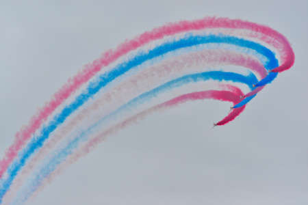 Hawk T1 jet operated by the British Royal Air Force's (RAF) Red Arrows aerobatic demonstration team, performs a maneuver at the 70th annual Canadian International Air Show (CIAS) over Lake Ontario in Toronto, ON, Canada on September 1, 2019のeditorial素材