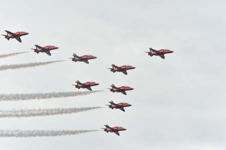 Hawk T1 jet operated by the British Royal Air Force's (RAF) Red Arrows aerobatic demonstration team, performs a maneuver at the 70th annual Canadian International Air Show (CIAS) over Lake Ontario in Toronto, ON, Canada on September 1, 2019のeditorial素材