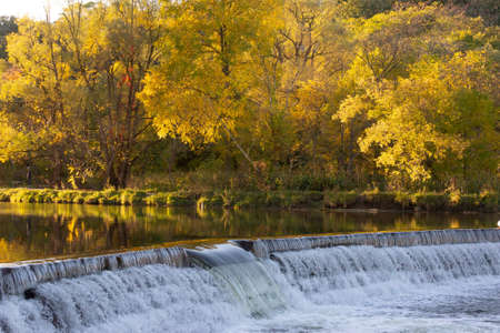 Old Mill dam at Humber River in Autumn, Toronto, Ontario, Canada