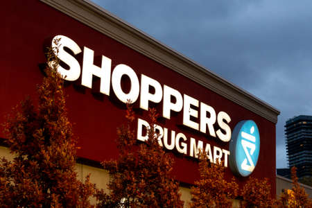 Toronto, ON, Canada - December 30, 2021: The logo and brand sign of Shoppers Drug Mart Store in...