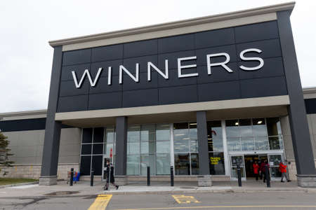 Toronto, ON, Canada - December 08, 2021: View at the brand identity sign over the entrance of a...