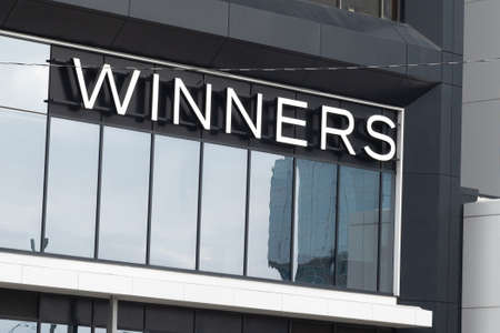 Toronto, ON, Canada - December 08, 2021: View at the brand identity sign over the entrance of a...