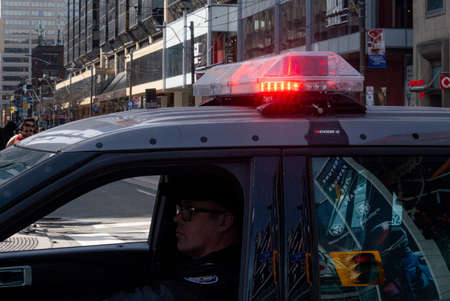 Toronto, ON, Canada - March 17, 2022: Police car during the St. Partick Parade in Downtown Toronto