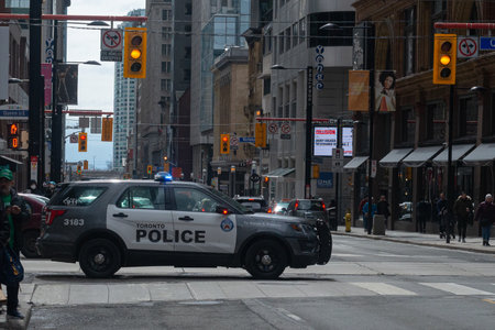 Toronto, ON, Canada - March 17, 2022: Police car during the St. Partick Parade in Downtown Toronto
