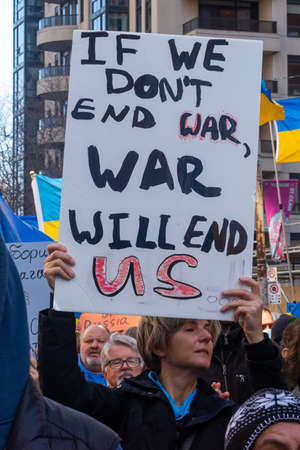 Toronto, Ontario, Canada â€“ March 6, 2022:  Demonstrators with yellow and blue Ukraine flags...
