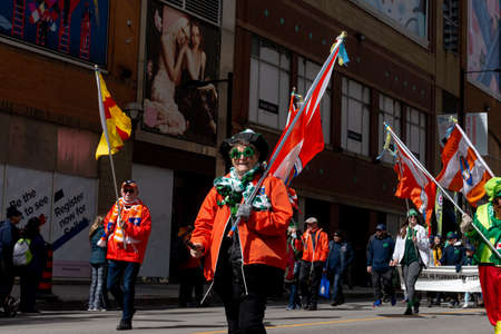 Toronto, ON, Canada â€“ March 20, 2022: People Take Part in the St Patrick's Day Parade in...
