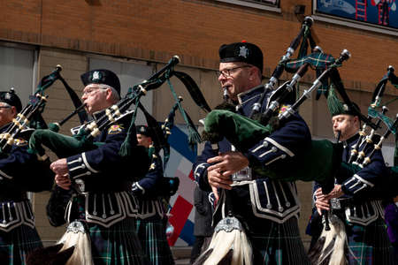 Toronto, ON, Canada â€“ March 20, 2022: Drummers and Pipers Take Part in a St Patrick's Day...