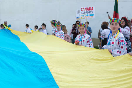 Toronto, ON, Canada â€“ May 19, 2022:  People in Ukrainian national clothes - Vyshivanka are...