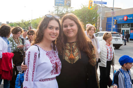 Toronto, ON, Canada â€“ May 19, 2022:  People in Ukrainian national clothes - Vyshivanka are...