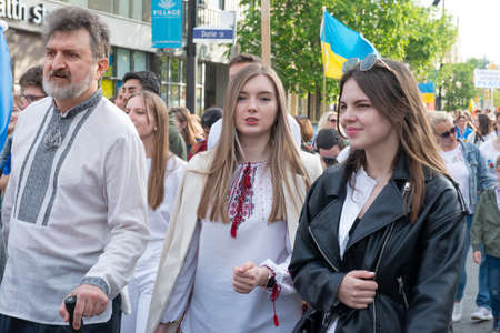 Toronto, ON, Canada â May 19, 2022:  People in Ukrainian national clothes - Vyshivanka are walking along the Toronto Street on Vyshivanka Day, which is celebrated by all Ukrainians around the world.のeditorial素材