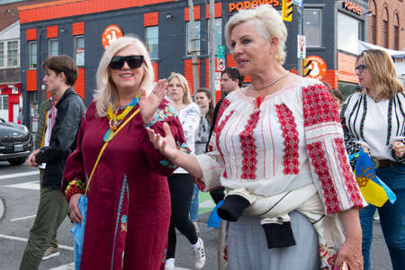 Toronto, ON, Canada â May 19, 2022:  People in Ukrainian national clothes - Vyshivanka are walking along the Toronto Street on Vyshivanka Day, which is celebrated by all Ukrainians around the world.のeditorial素材