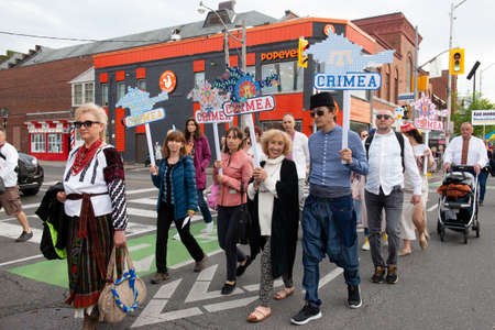 Toronto, ON, Canada â€“ May 19, 2022:  People in Ukrainian national clothes - Vyshivanka are...