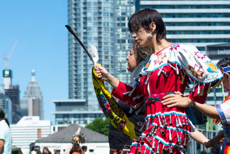 Toronto, ON, Canada - June 18, 2022: Dancer during the National Aboriginal Day and Indigenous Arts Festival. The festival celebrates Indigenous and Metis culture through traditional and contemporary music, educational programming, storytelling, dance, theのeditorial素材