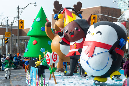 Toronto, ON, Canada â November 20, 2022: People take part in the 118th Toronto Santa Claus Parade in Toronto, Canada on November 20, 2022のeditorial素材