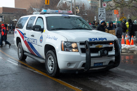 Toronto, ON, Canada - November 20, 2022: Police car on the streets of Toronto during the Santa Claus Paradeのeditorial素材