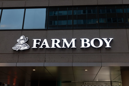 Toronto, Canada â December 10, 2022: View at Farm Boy retail store logo on the facade of the building.  Farm Boy Inc. is a Canadian food retailer operating in Ontarioのeditorial素材