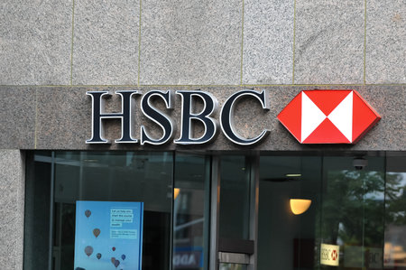 Toronto, ON, Canada â December 17, 2022: The logo and brand sign of HSBC bank. HSBC Holdings plc is a British multinational universal bank and financial services holding companyのeditorial素材