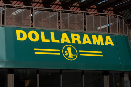Toronto, ON, Canada â December 17, 2022: Close-up of Dollarama store sign on the building. Dollarama Inc. is a Canadian dollar store retail chainのeditorial素材