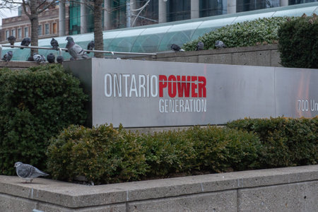 Toronto, ON, Canada - December 17, 2022: View at the sign of Ontario Power Generation at the head office in Toronto in winter.のeditorial素材