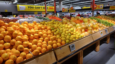 Toronto, ON, Canada - December 6, 2025: A vibrant selection of fresh produce, including apples and other fruits and vegetables, is displayed in the retail section of a supermarketのeditorial素材