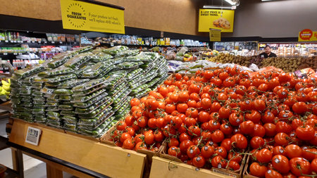 Toronto, ON, Canada - December 6, 2025: A vibrant selection of fresh produce, including apples and other fruits and vegetables, is displayed in the retail section of a supermarketのeditorial素材