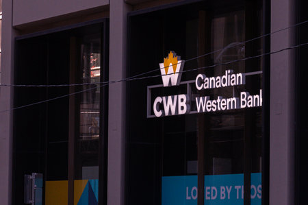 Toronto, ON, Canada - September 15, 2025: A CWB Canadian Western Bank sign is mounted on the outside of a modern-style office building.のeditorial素材