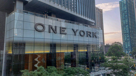 Toronto, ON, Canada - September 17, 2025: The modern One York Street office skyscraper is photographed on a sunny day with clouds in the sky.のeditorial素材