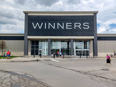 Toronto, ON, Canada - May 26, 2025: View at the brand identity sign over the entrance of a Winners...