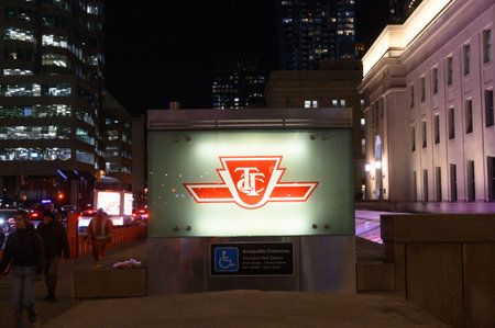 Toronto, ON, Canada â February 24, 2024: The sign of the Toronto Transit Commission transport company in Downtown Torontoのeditorial素材