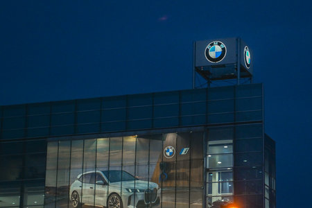 Toronto, ON, Canada - August 30, 2025: An illuminated BMW car dealership building in Toronto.のeditorial素材
