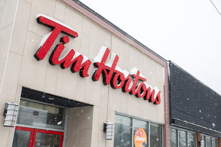 Toronto, ON, Canada - March 2, 2025: Tim Hortons Inc., commonly nicknamed Tim's, or Timmie's is a Canadian coffeehouse and restaurant chainのeditorial素材