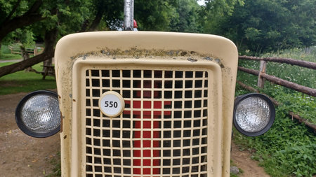 Toronto, ON, Canada - September 25, 2025: A vintage Cockshutt farm tractor is parked next to a rustic wooden fence in a pasture.のeditorial素材