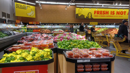 Toronto, ON, Canada - December 6, 2025: A vibrant selection of fresh produce, including apples and...