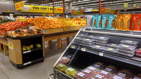 Toronto, ON, Canada - December 6, 2025: A vibrant selection of fresh produce, including apples and other fruits and vegetables, is displayed in the retail section of a supermarketのeditorial素材