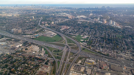 Toronto, ON, Canada - October 10, 2025: The aerial shot depicts Toronto suburbs with busy highways...