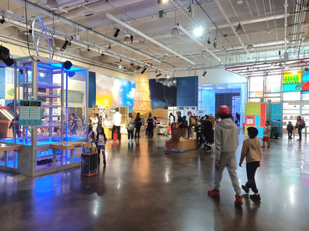 Toronto, ON, Canada - May 17, 2024: People explore various interactive exhibits at Ontario Science Centre; the space is modern and full of light.のeditorial素材