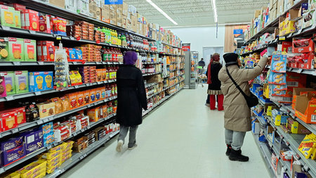 Toronto, ON, Canada - March 13, 2026: People do grocery shopping and walk through the aisle in a...