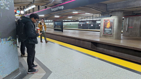 Toronto, ON, Canada - March 13, 2026: People wait on the platform at Sheppard-Yonge subway station...