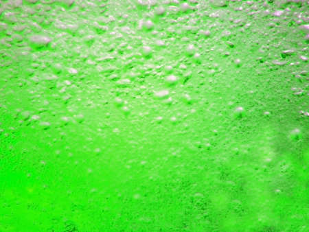Water in the swimming pool is green. Background. Details about water. Drops of water. Blurred....