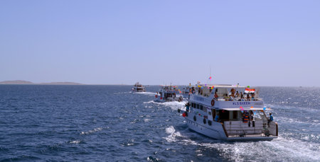 Egypt, Sinai, Sharm el-Sheikh, Red Sea, September 27, 2014: A white pleasure boat in the Red Sea off the coast of Sharm el-Sheikh, Egypt. A lot of people rest on the boatのeditorial素材