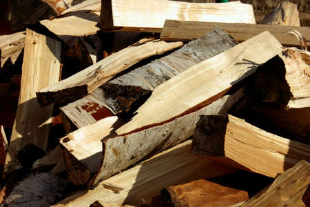 Abstract photograph of piles of natural wooden logs. Background. Harvesting firewood for the winter. Texture. Wood for the fireplace. Birch boards. Macrosymka. Copy space.の写真素材